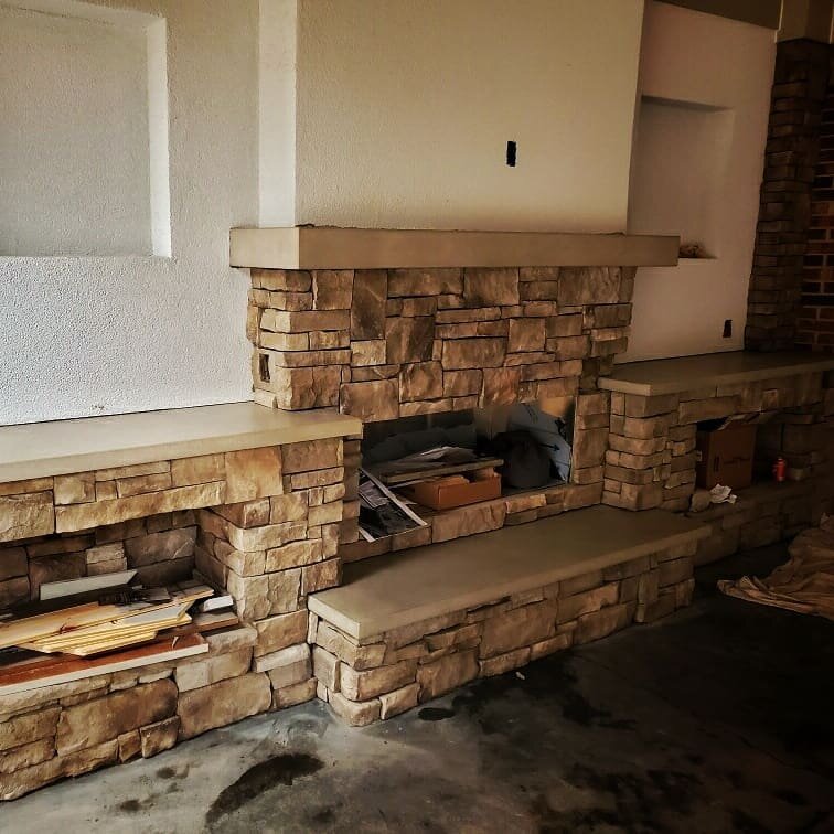While there is still work to be done, this awesome fireplace now has new concrete mantle and hearth pieces. A beautiful way to cap off the rock work.