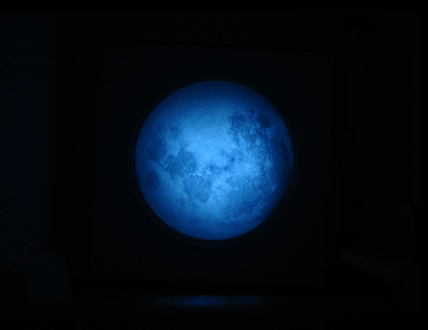 illuminations, 2007, magic lantern, original glass slide of moon 1890, solar torch, digital projection