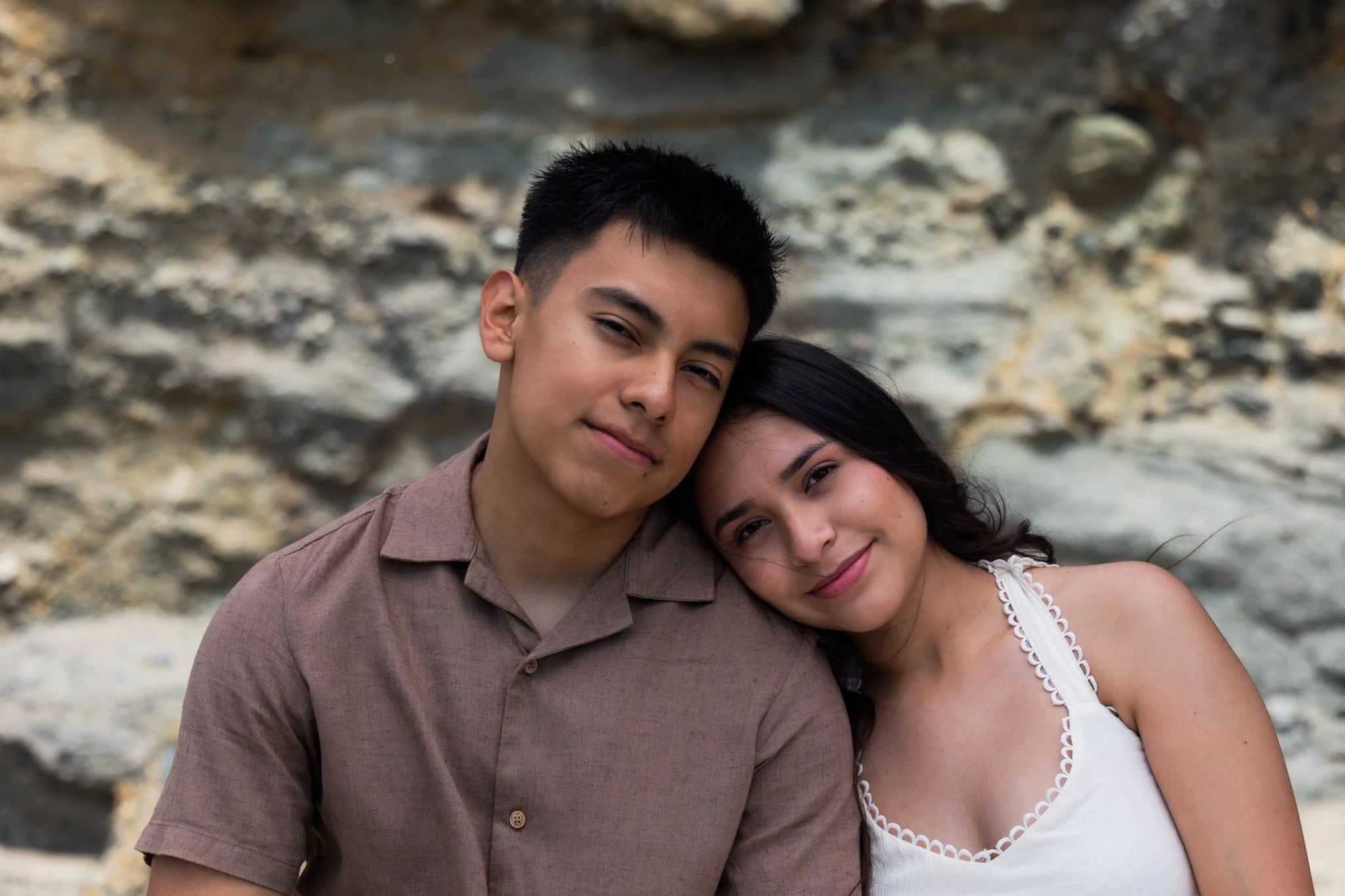 Emily leans on Eduardo's Shoulder