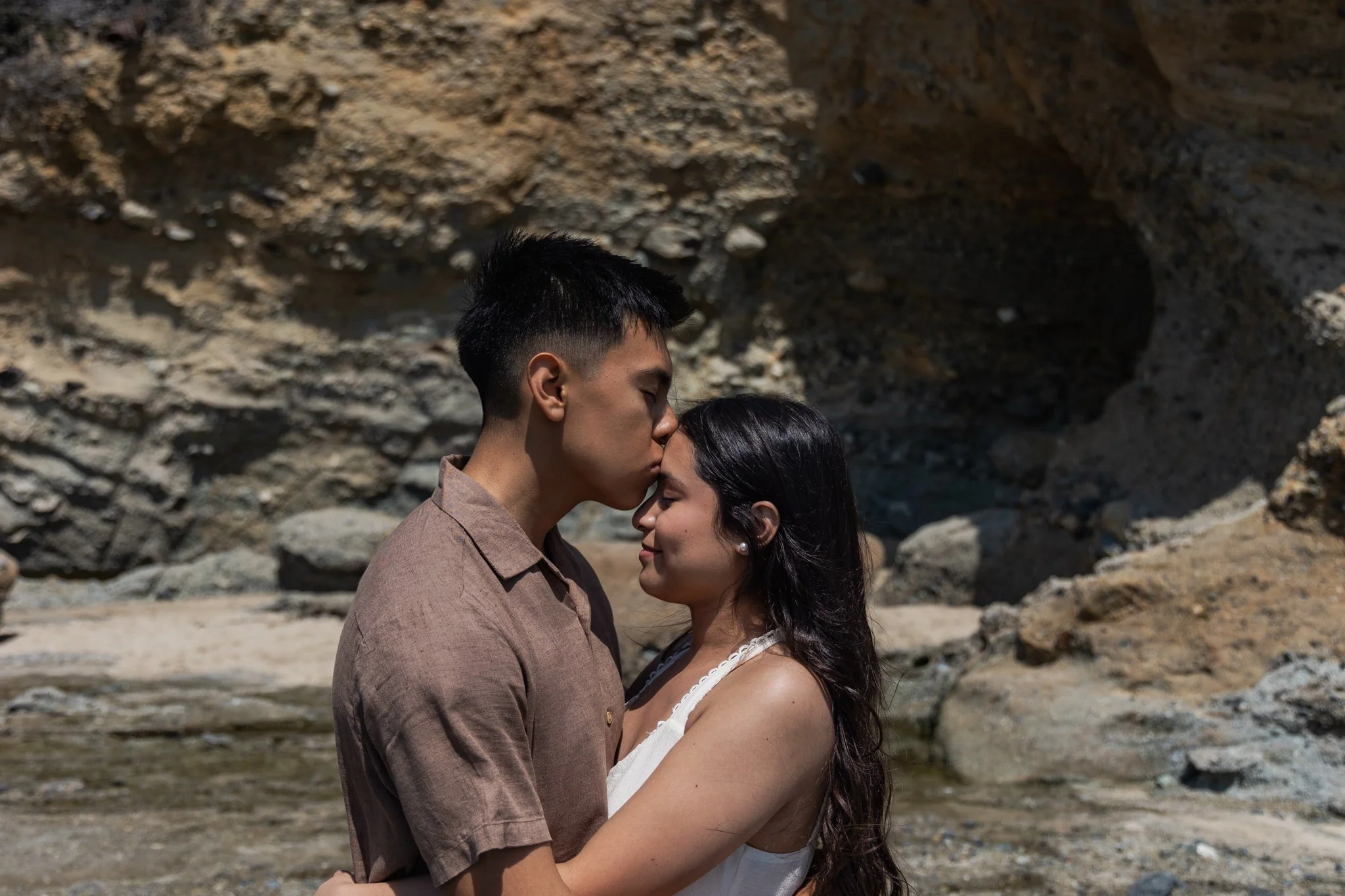 Eduardo kissing Emily's Forehead 