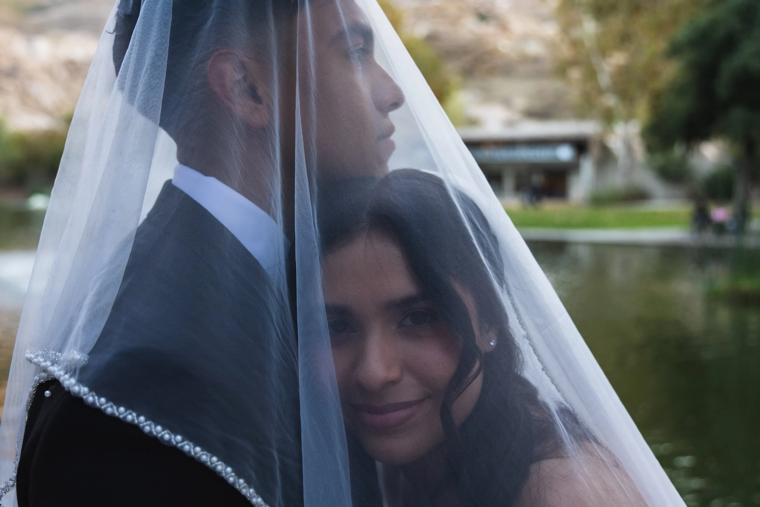 Emily and Eduardo under the veil