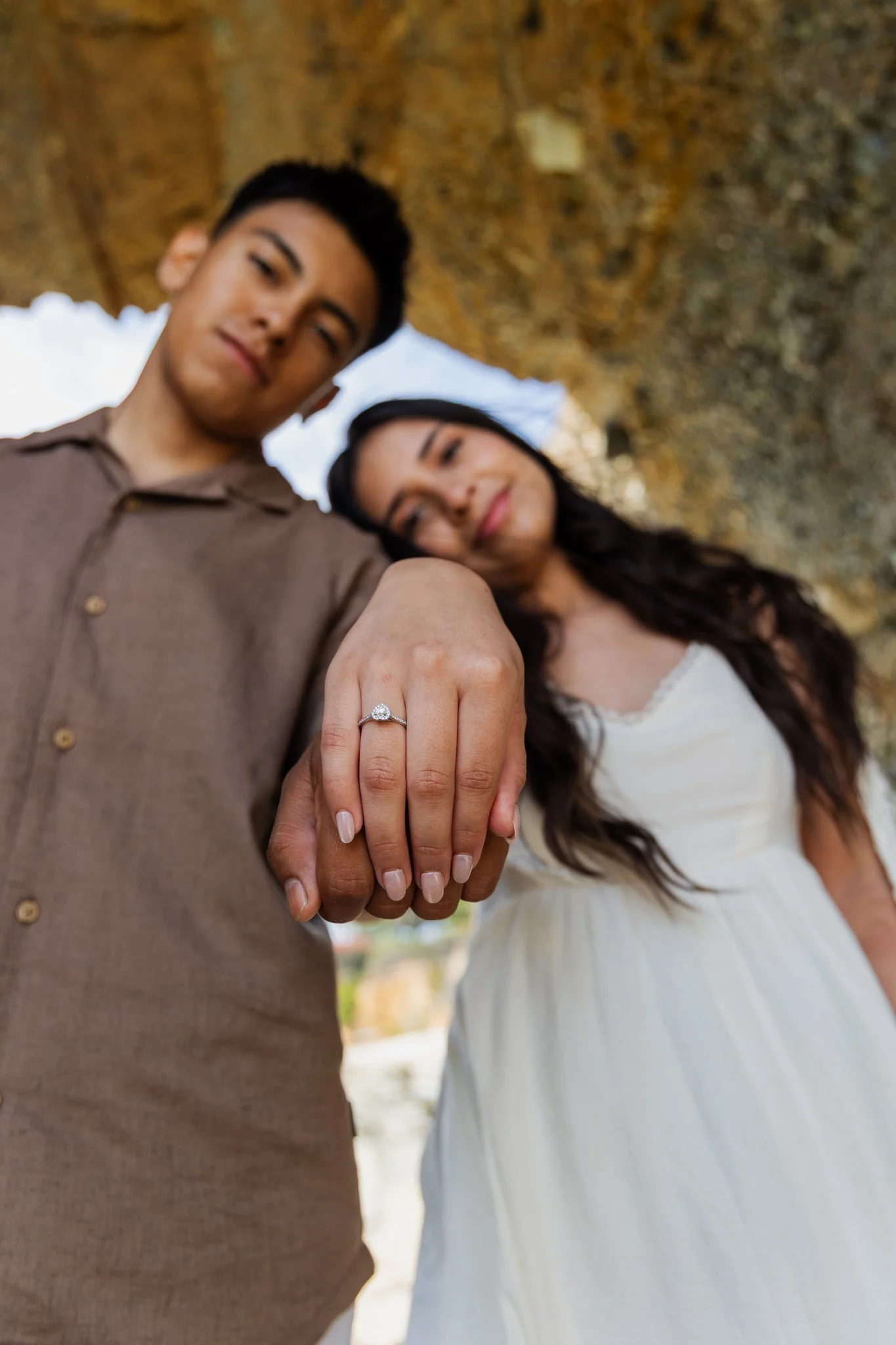 Emily and Eduardo show engagement ring