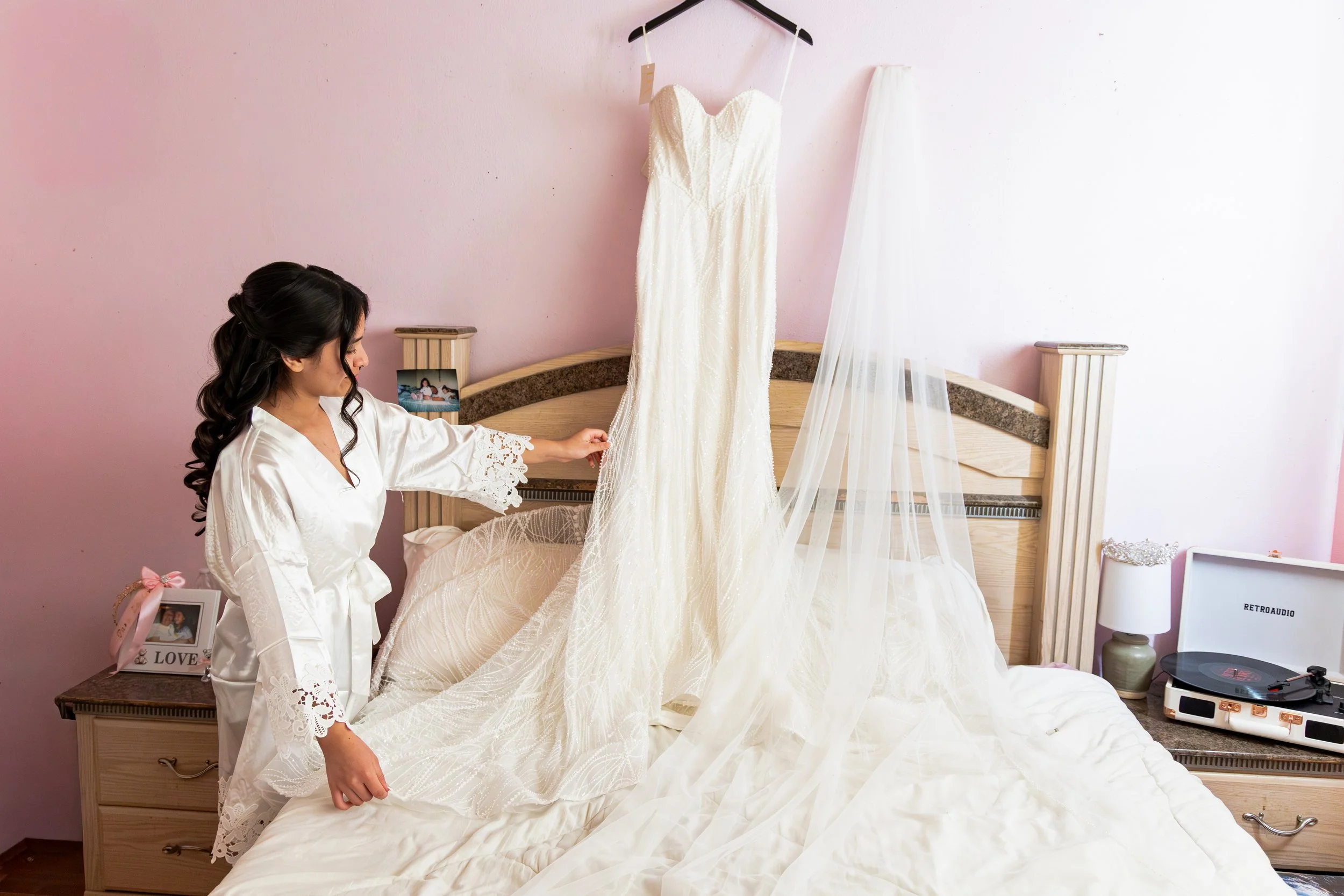 Emily looking at her weding dress