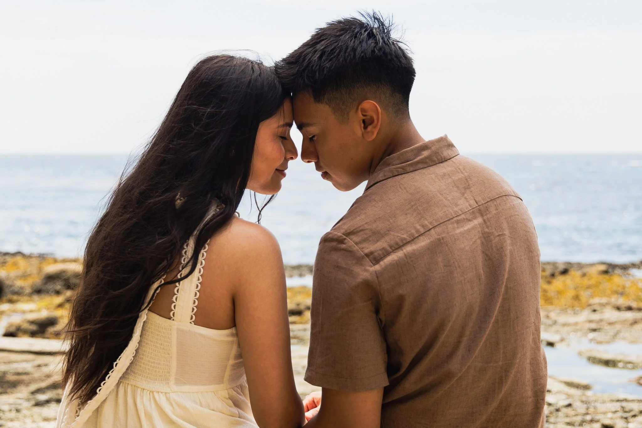 Emily and Eduardo touch foreheads
