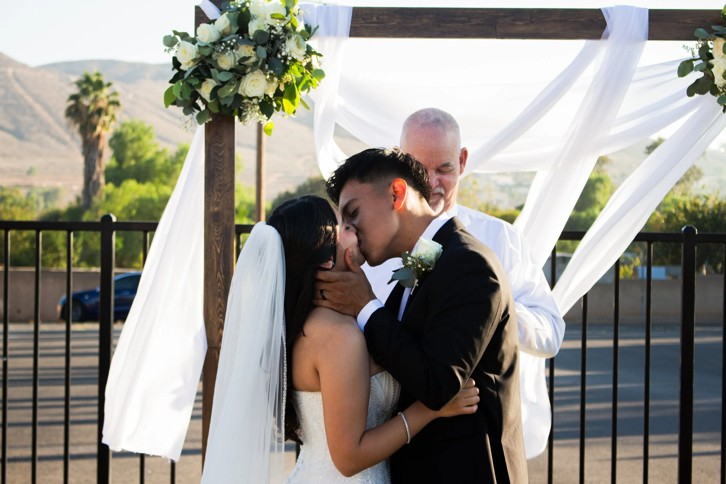 Emily and Eduardo kiss after saying I do 