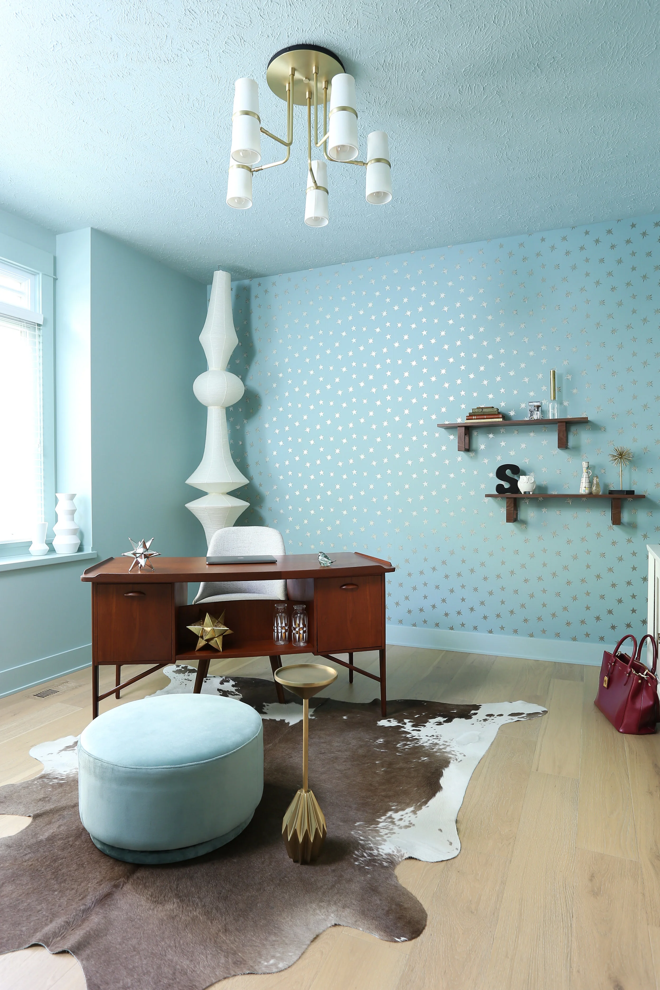 There is definitely nothing boring about this playful, modernist office that expertly reflects the soul of the client. The Akari Light Sculpture is by Isamu Noguchi - an iconic statement for this midcentury modern space.