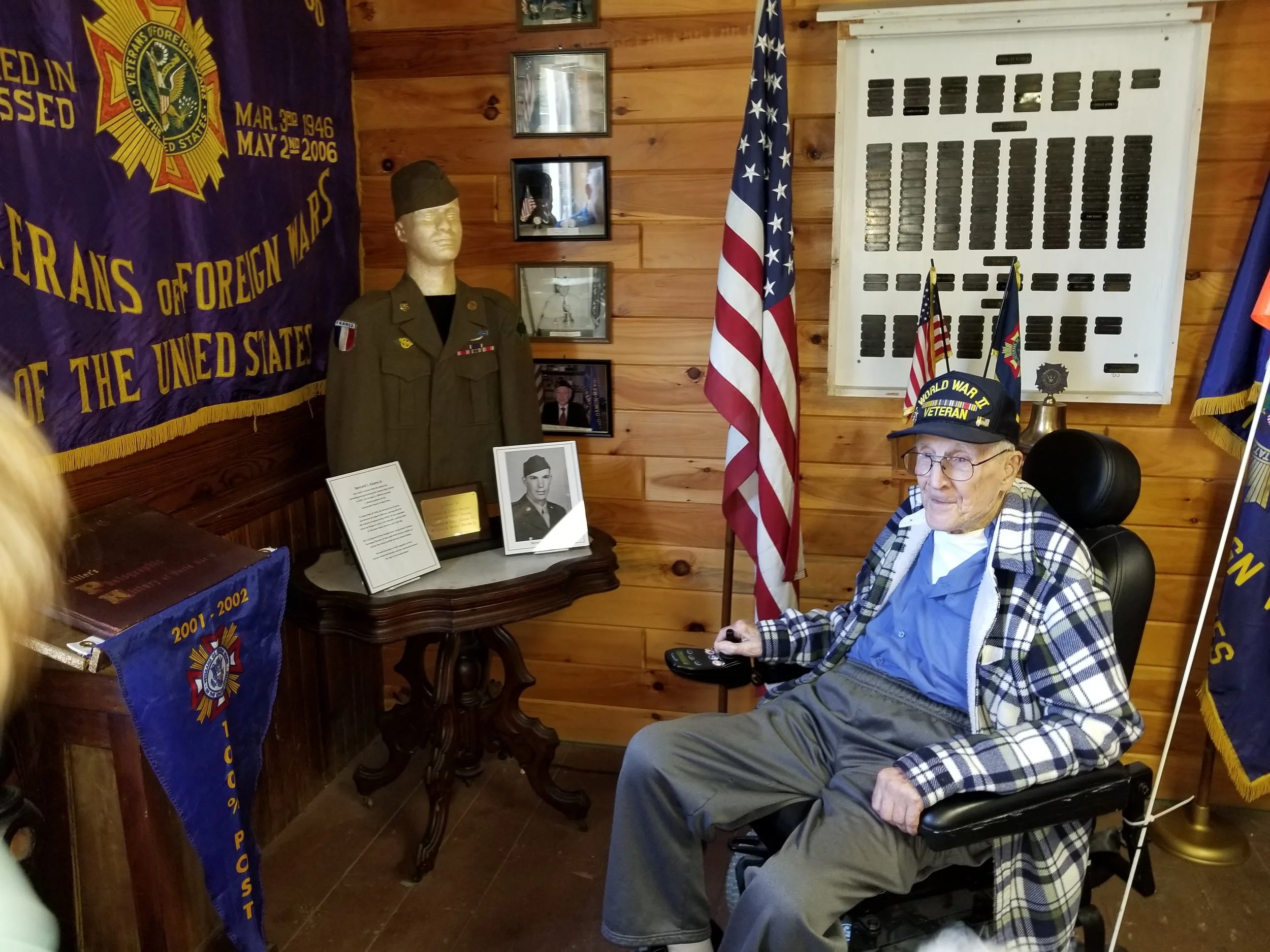 WWII Veteran Bernard Adams visits his exhibit in the museum room.