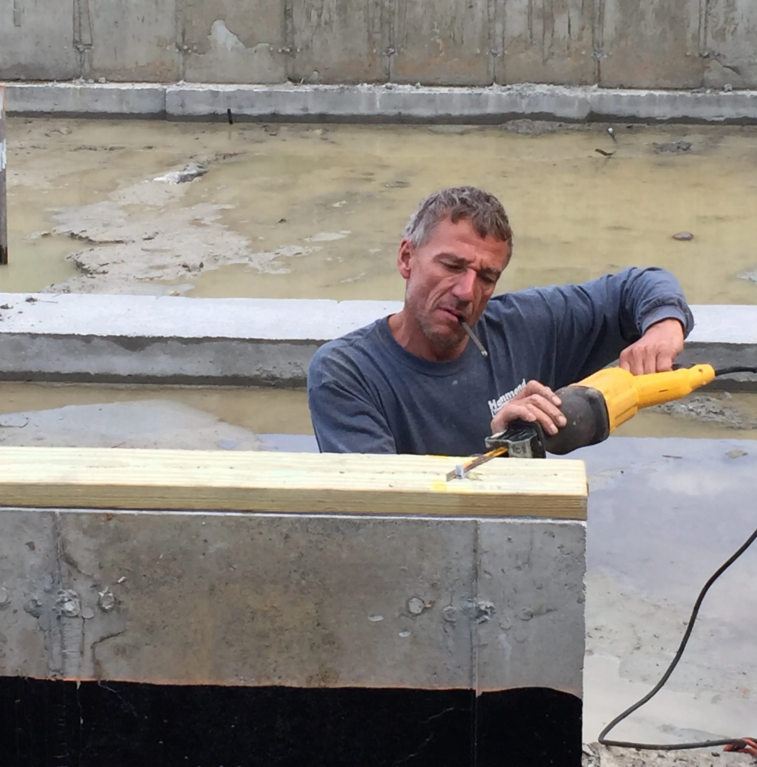 Rene Ouellette preparing the new foundation for the building's move.