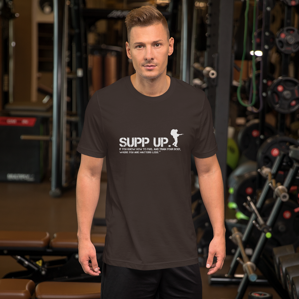 Printful---SUPP-UP-Soldier-Ruck-Front-Logo-and-Slogan-DARK_Printful---SUPP-_mockup_Front_Mens-Lifestyle_Brown.png