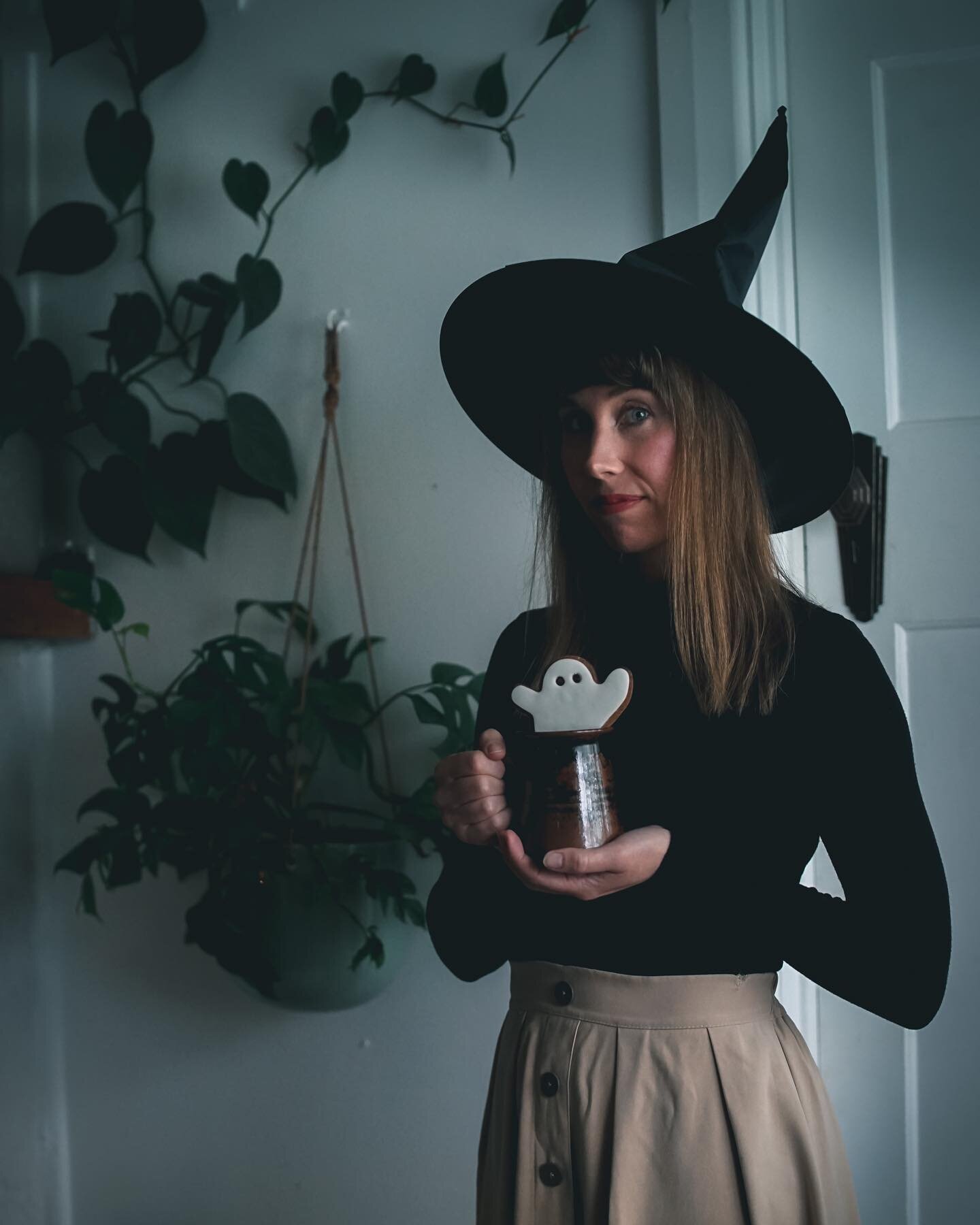 Happy Halloween friends! 
🕸
Getting into the spooky spirit by wearing a witch hat and holding a ghost cookie, which I&rsquo;m about to eat👻🕸, albeit very slowly as I just had braces put onto my teeth. It&rsquo;s not fun, especially when you want t