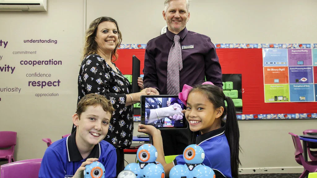 Harvey Primary School parents and citizens committee vice president Narelle Bacich presents school principal Jason Romeo with ipads and Dash and Dot robots, which Year 6 student leaders Mitchell Robinson and Issa Ballares are happy to test run.Picture:Picture: Jacinta Cantatore / Harvey-Waroona Reporter