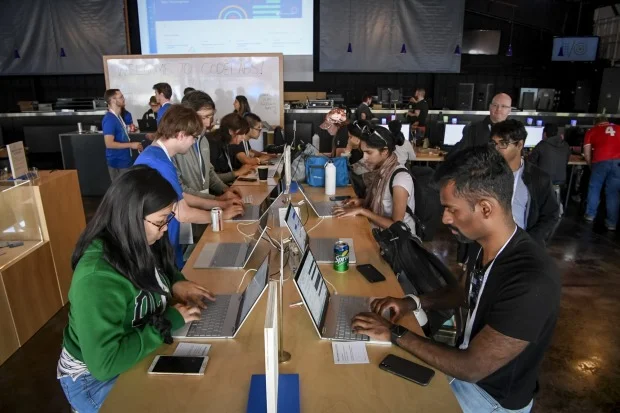 Attendees work on laptop computers in the CodeLabs work room during the Google I/O Developers Conference. Each year, Google uses the start of its annual conference to set a narrative about how developers and the public should view the company. This time, the message was clear: Google is about technology for good. DAVID PAUL MORRIS