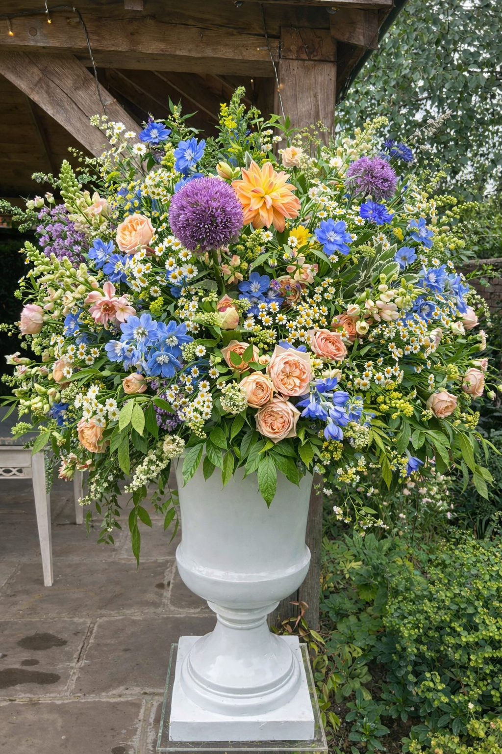 Summer wedding flowers in urn
