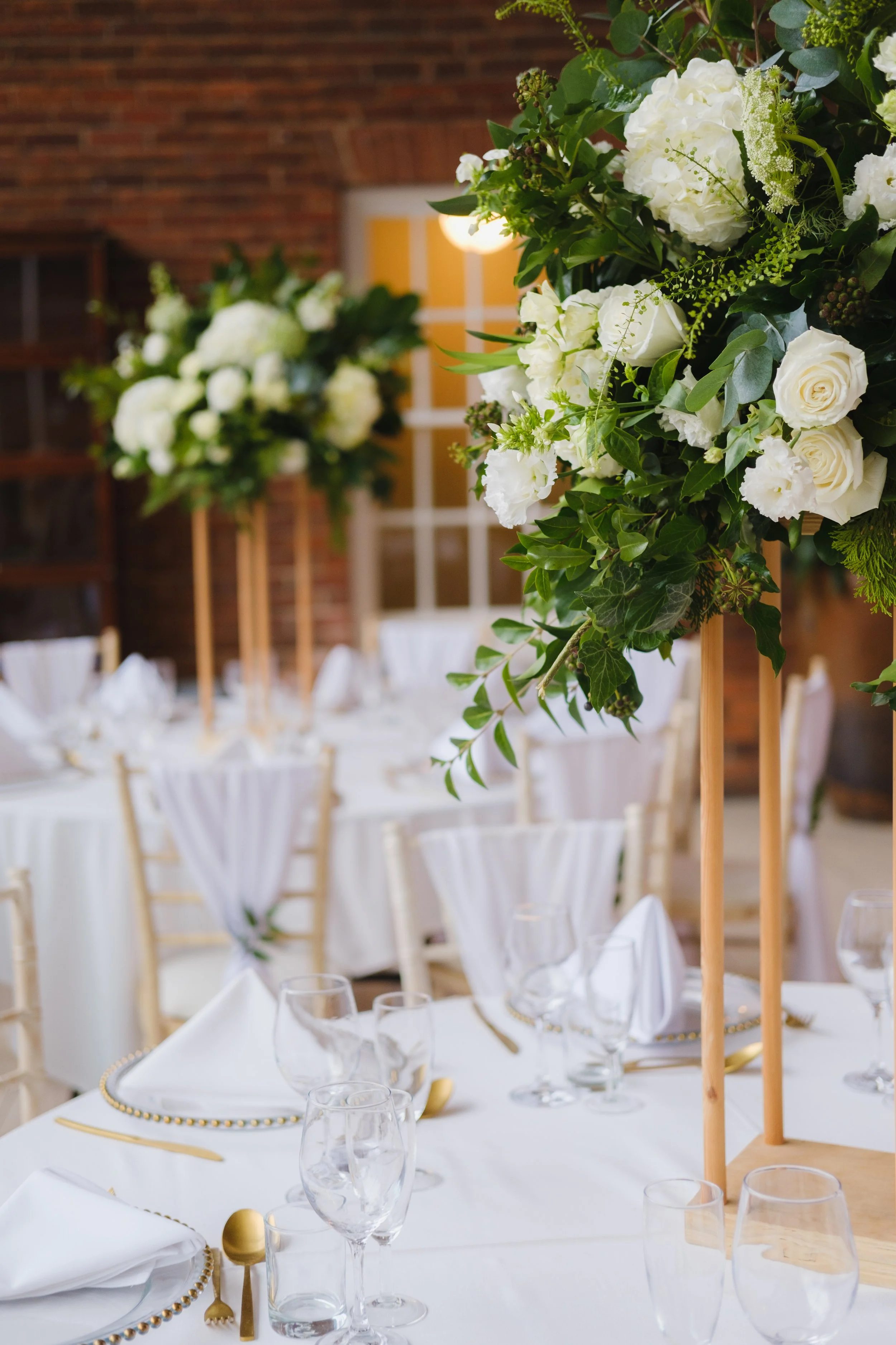 white and green tall wedding table arrangements