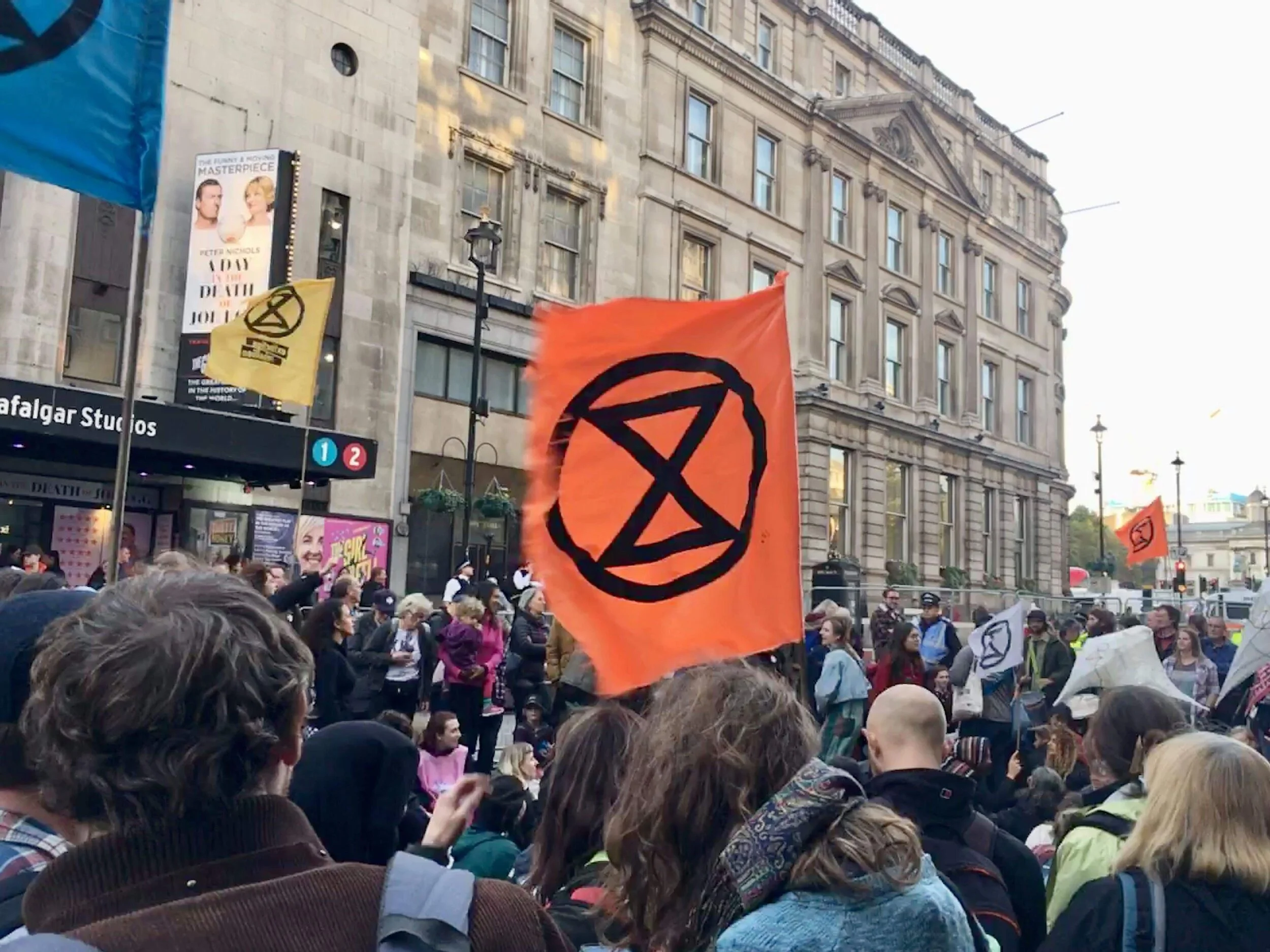 Extinction Rebellion (hourglass symbol) protesters just outside our pub for Happy Hour