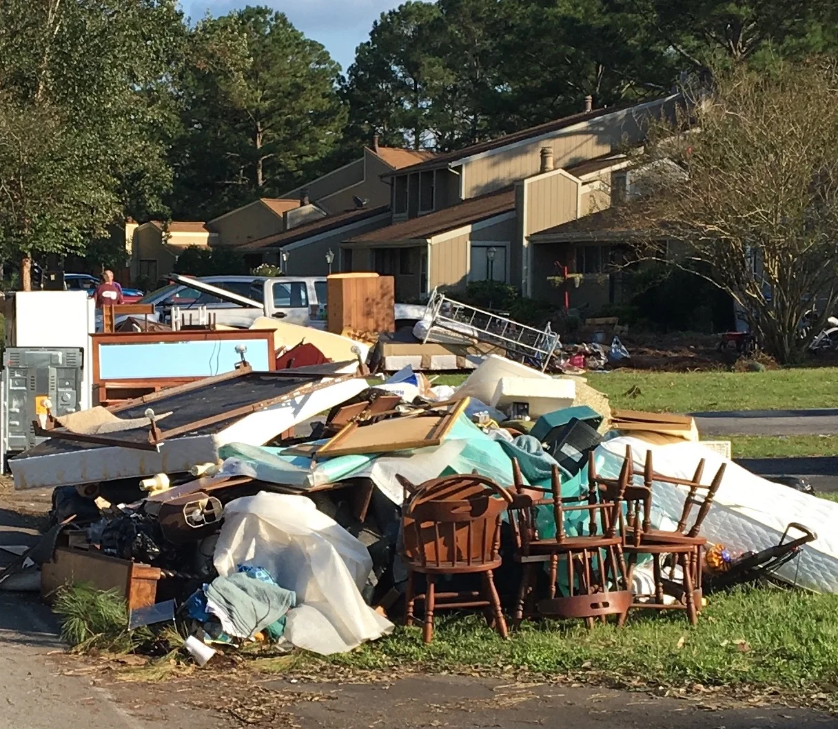 Piles of discarded furnishings line the streets of River Bend, a neighborhood west of downtown New Bern, NC.