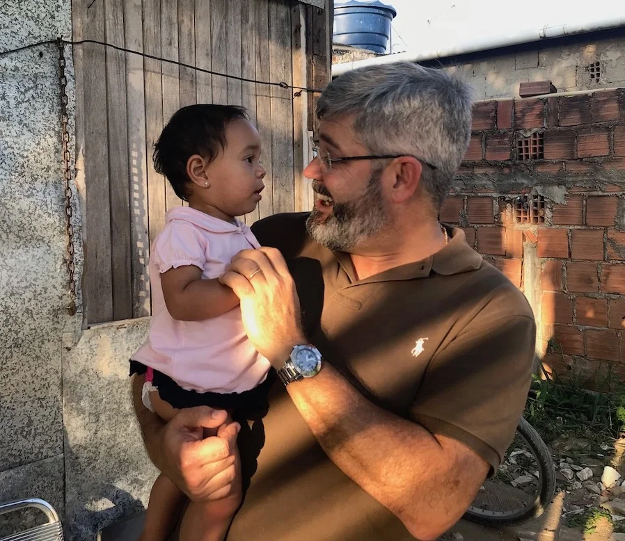 Pastor Leo Dourado demonstrates God’s “forever love” to a child in the slums of Recife, Brazil.