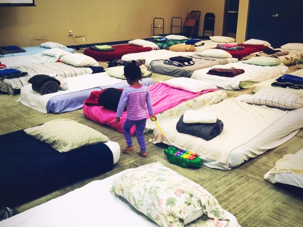 Young asylum seeker gets ready for rest after her long journey. Photo credit: Laurie Smith Photography
