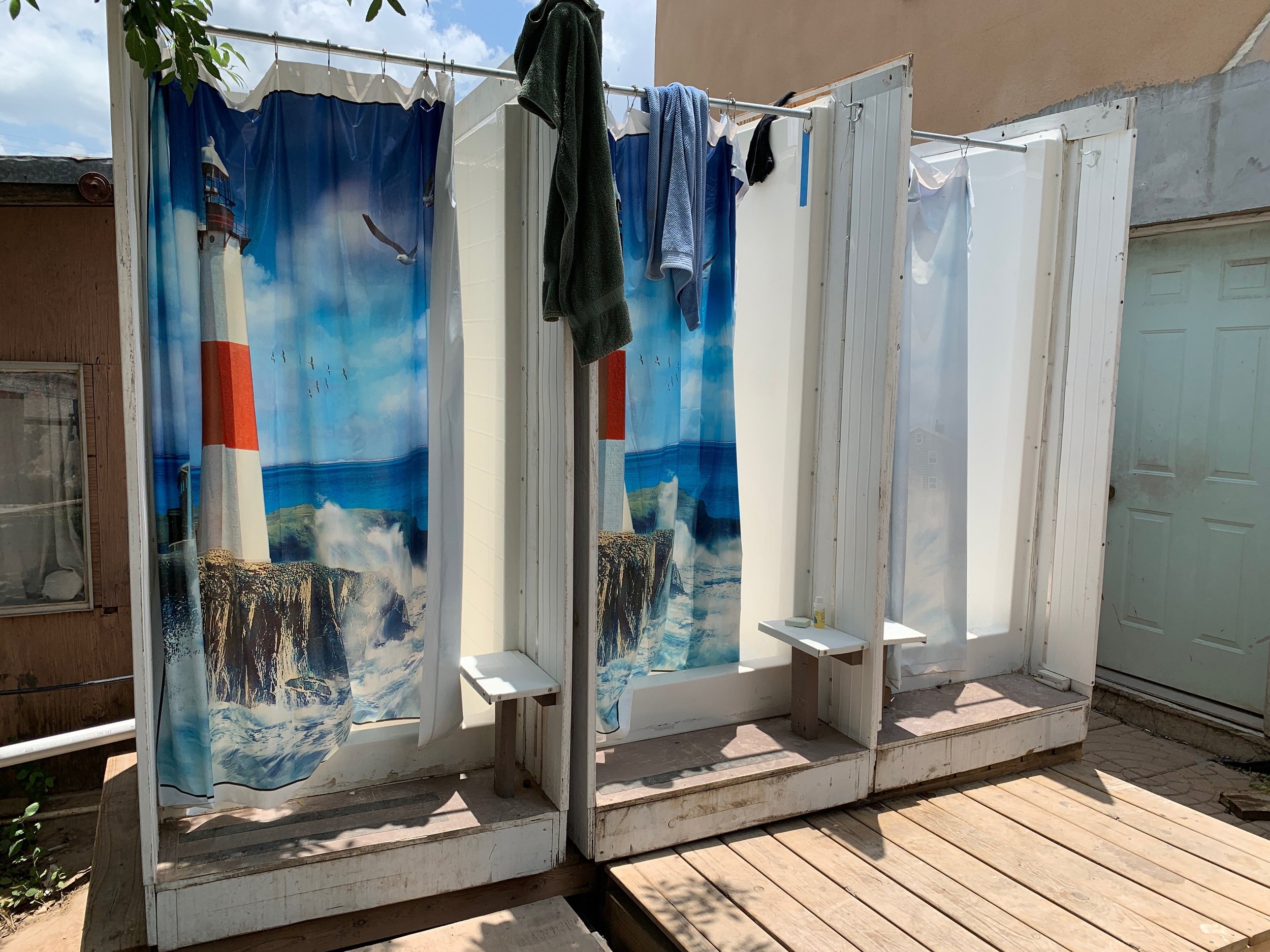 Showers for refugees provided by Texas Baptist Men. It’s the most popular area because refugees have not bathed in 8 to 10 days. You can see their relief after a shower!
