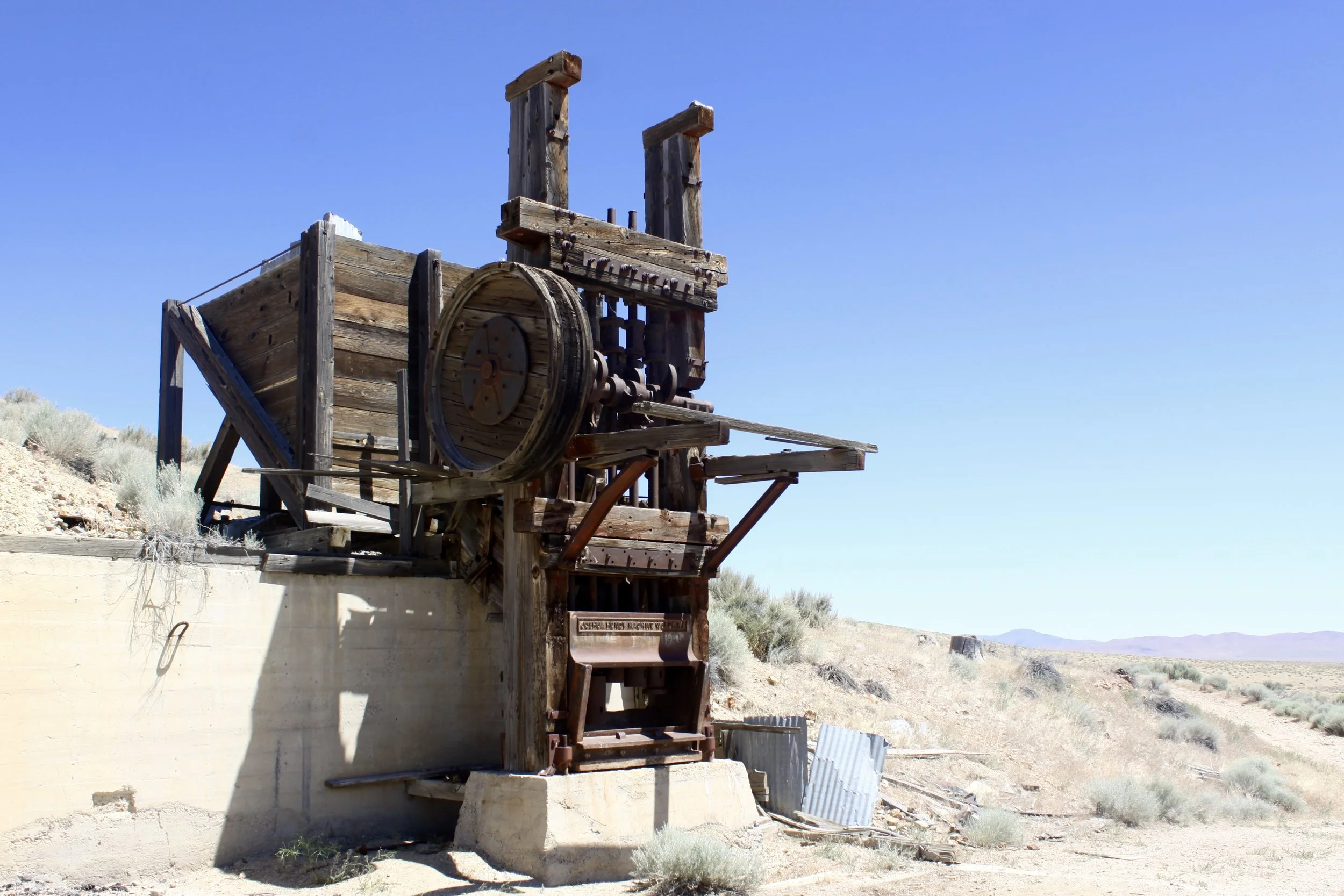 Old “5-Stamp” mill. Ore was loaded above and behind the stamp mill, and as the ore traveled down it was hammered or “Stamped” into smaller pieces. There are 5 stamps on this mill. The ore was then taken below to the cyanide ponds for gold separation.