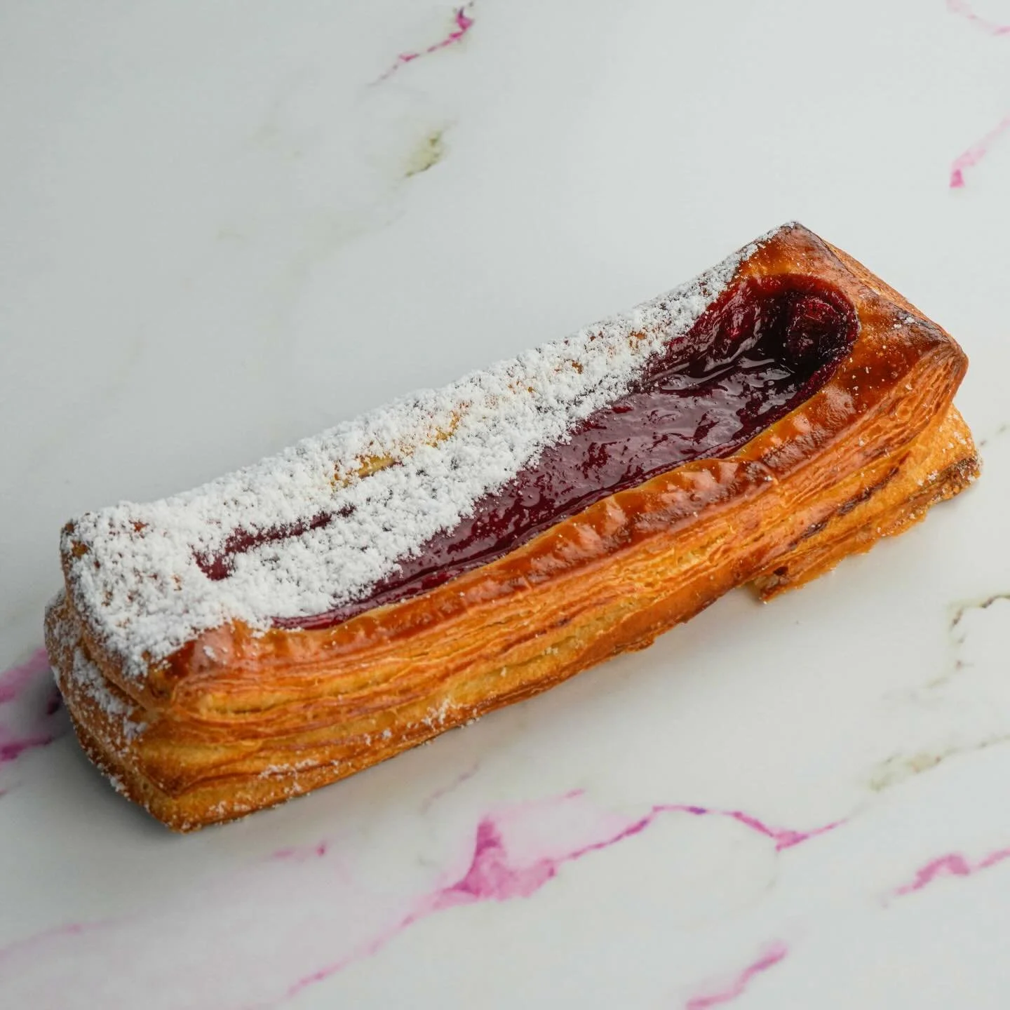 Introducing the Strawberry &amp; Raspberry Croissant! Flaky, buttery layers filled with bright, juicy berries for the perfect balance of sweet and tart. A spring pairing with your cup of coffee. 🍓🥐