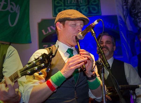 Former H+A Associate, Jeremy Bauer, Plays his Irish Whistle with Coming Up Threes