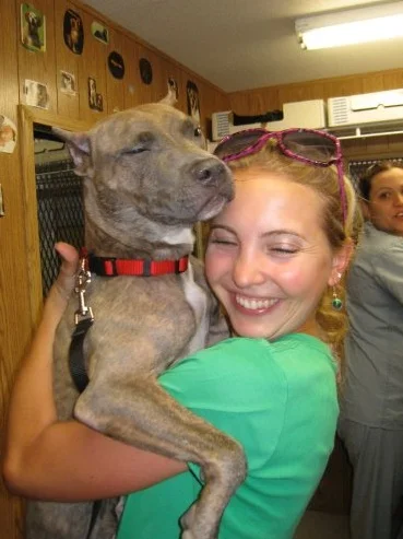 Mocha with her adopter, signing the papers