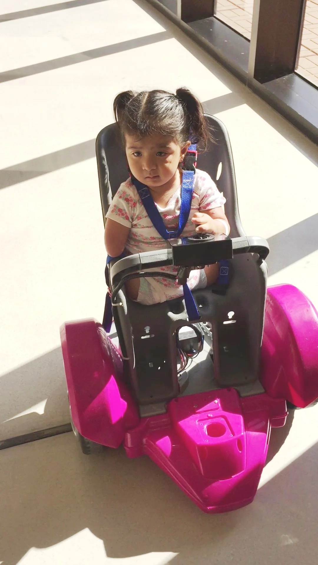Little Miss on her trial chair this past fall. She actually went home in a little car smaller than this.