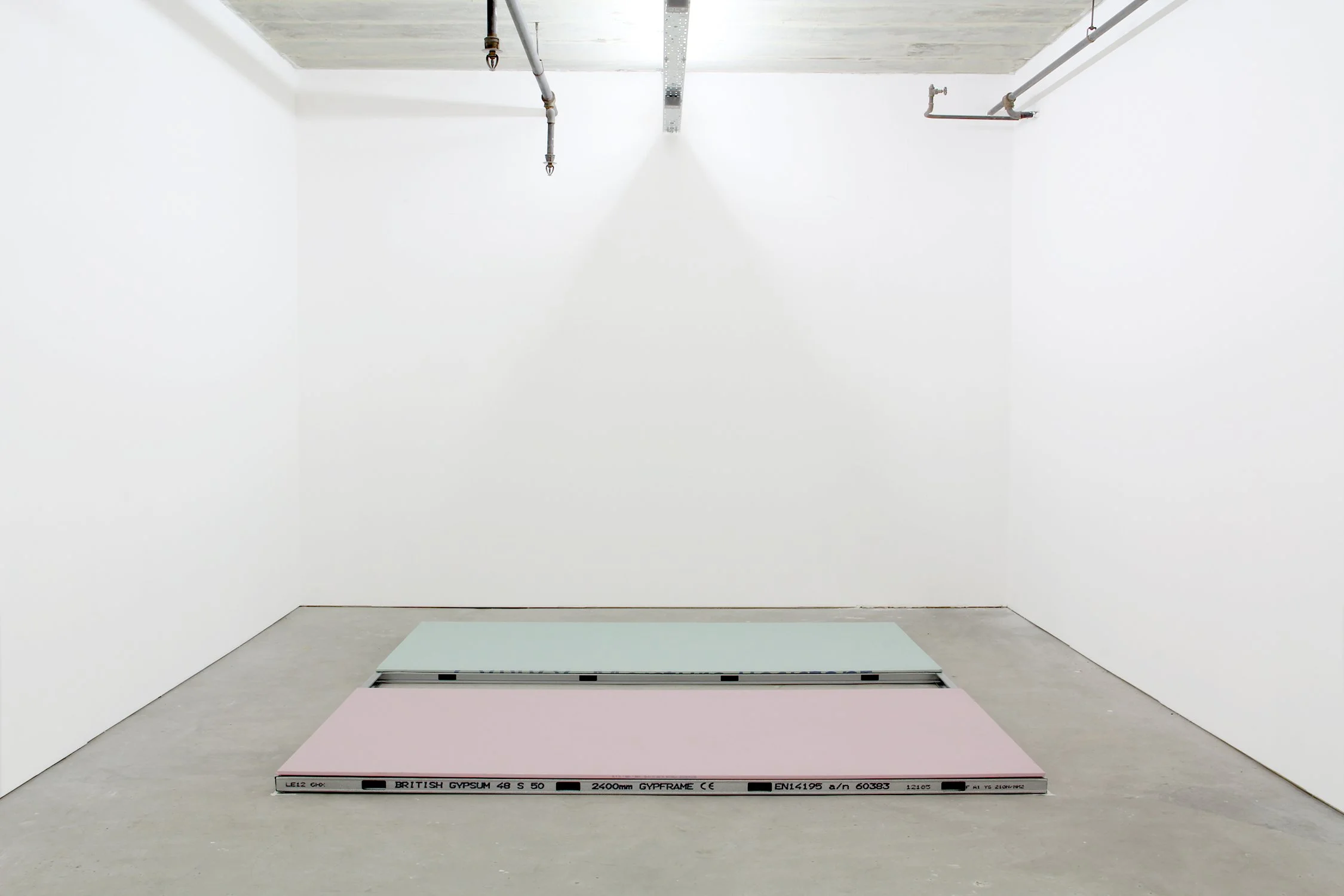  Plasterboard in Pastel, 2014, fire-retardant (pink) and mold-retardant (green) sheetrock and metal studs, 8’x8.5”.  