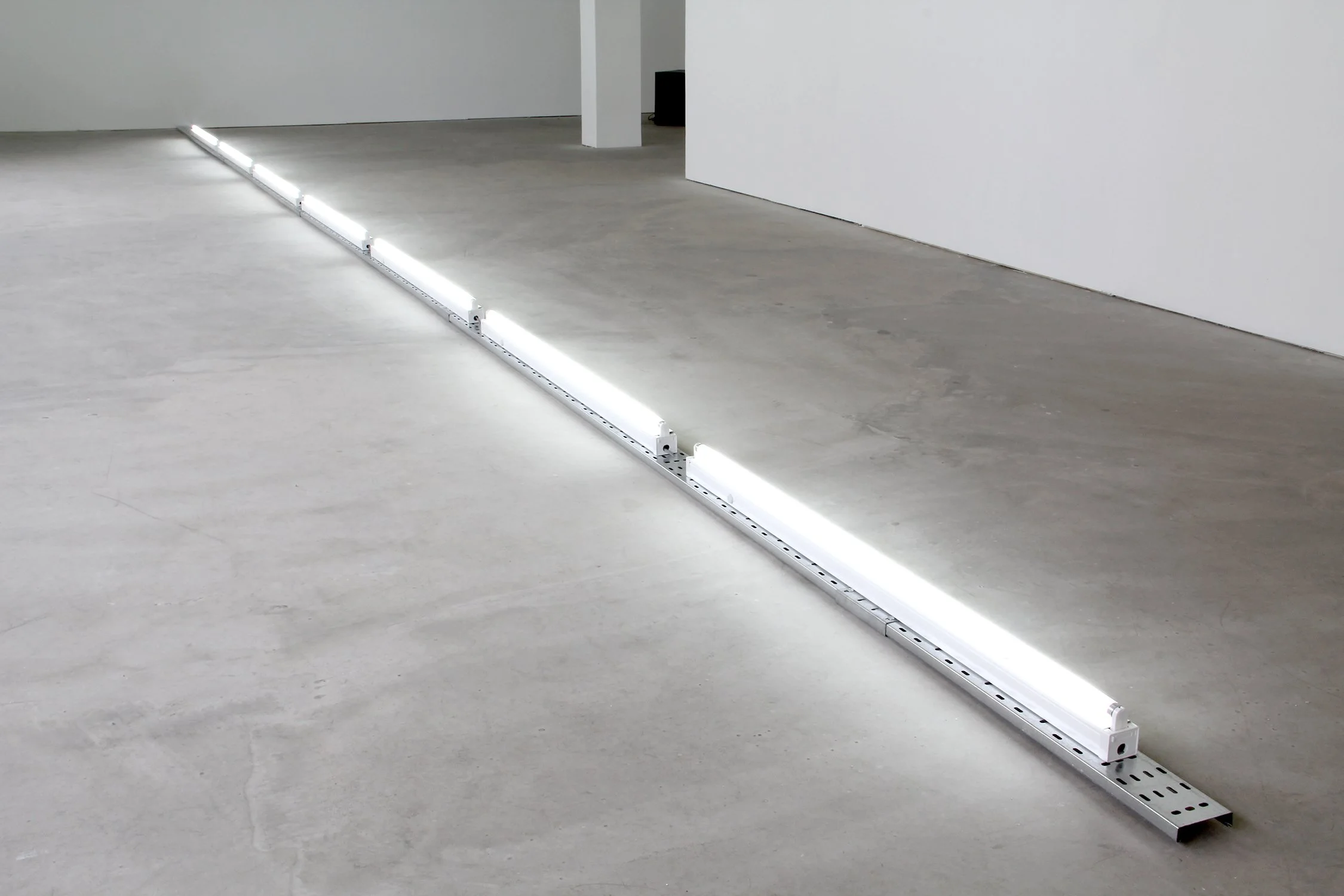  Echo, 2014, fluorescent lights, electric cable trays, 4”x35’. 