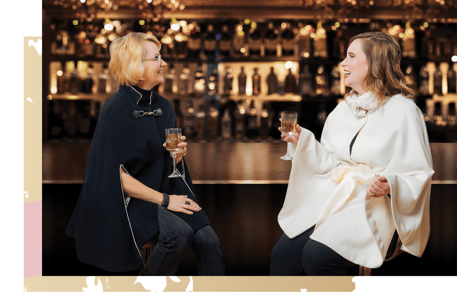 ladies wearing capes on bar stools.png