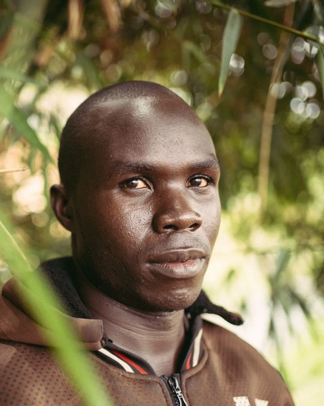Joseph Okaka works on the banks of the Nairobi River in Korogocho, one of the city's densest informal settlements. His team collects waste from the river, sorts it, processes it, and sells it to recycling companies. Glass bottles become gabions. Plas
