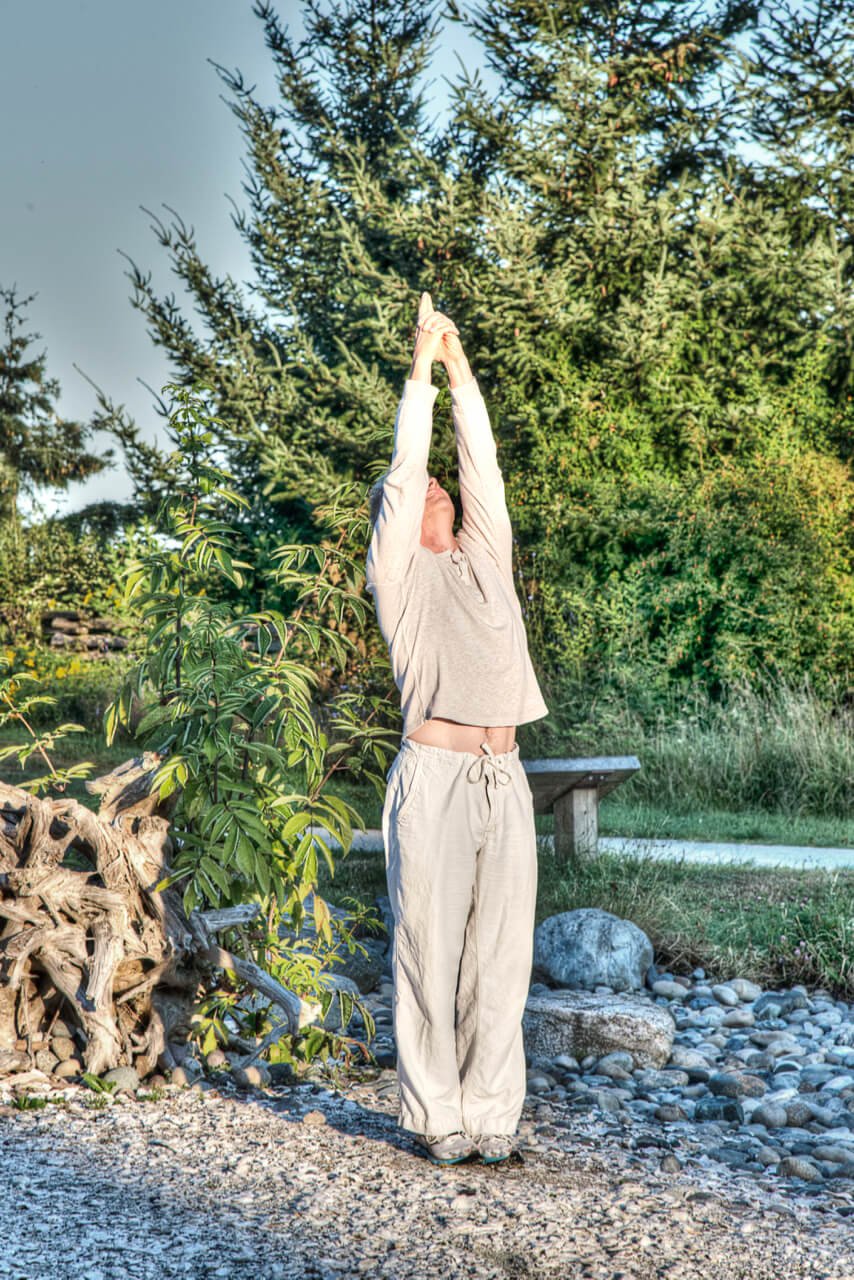FitLifeMove | fitness and wellness for adults 55 and over | Michel Duran doing yoga sun salutation outdoor.jpg