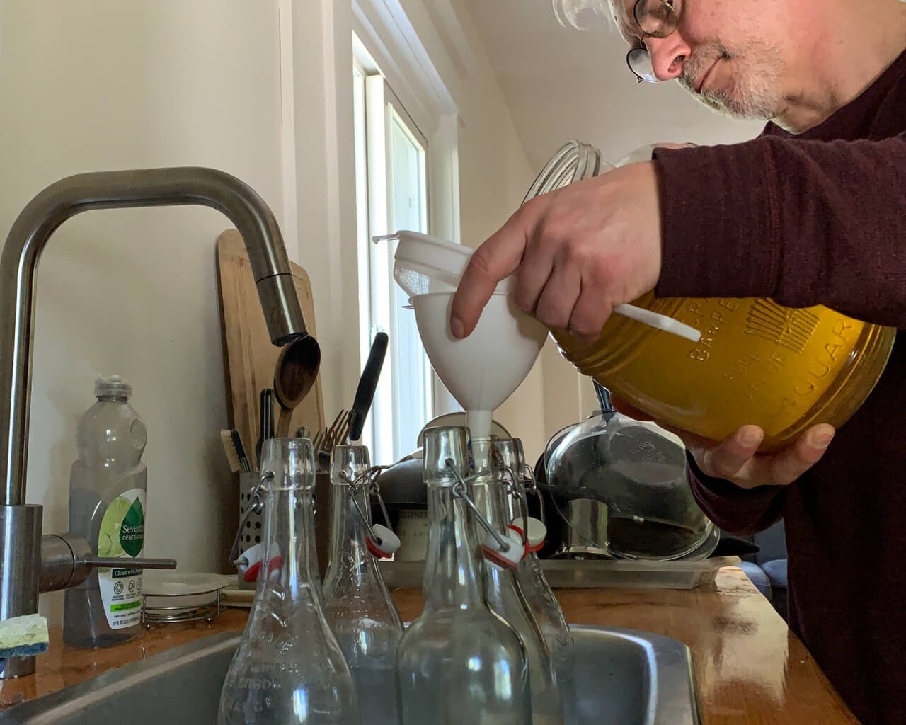 FitLifeMove |fitness and wellness for adults 55 and over | Michel Duran filling up bottle of kombucha.jpg