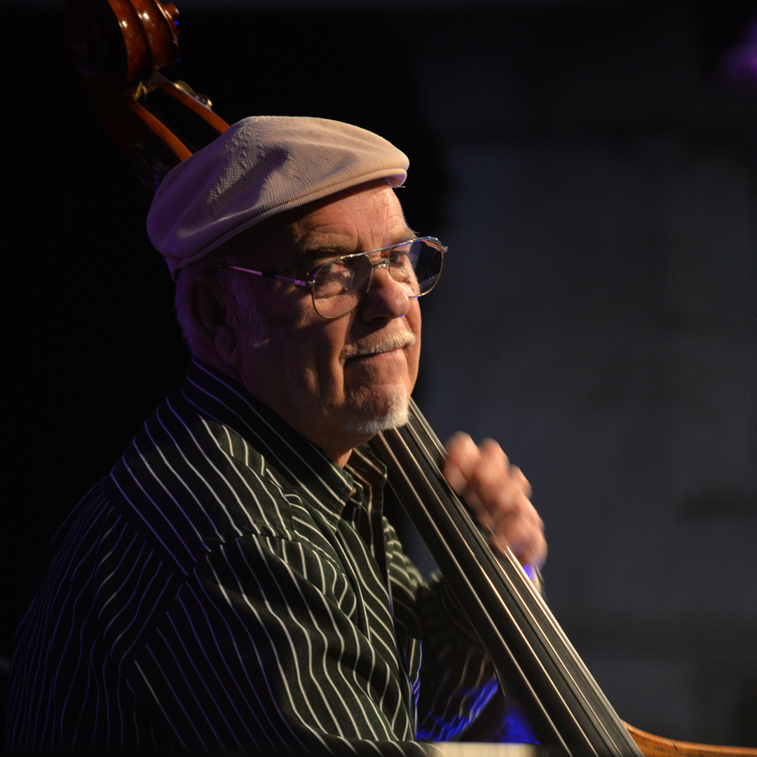 Close up of man on double bass