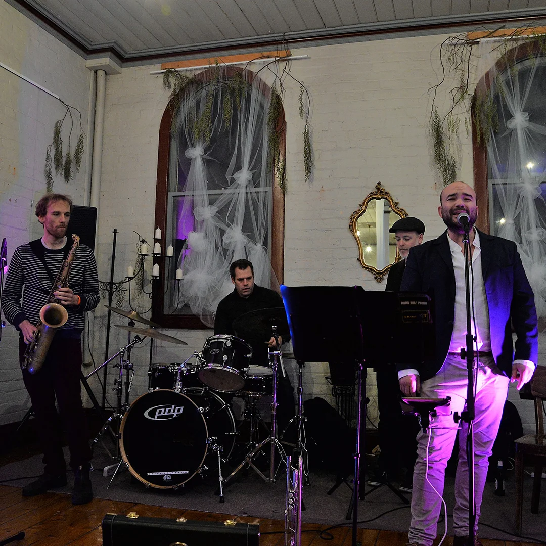 Three piece band performing