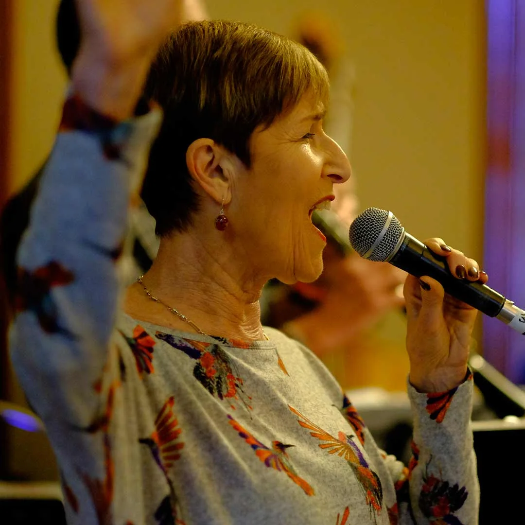 Singer with raised arm