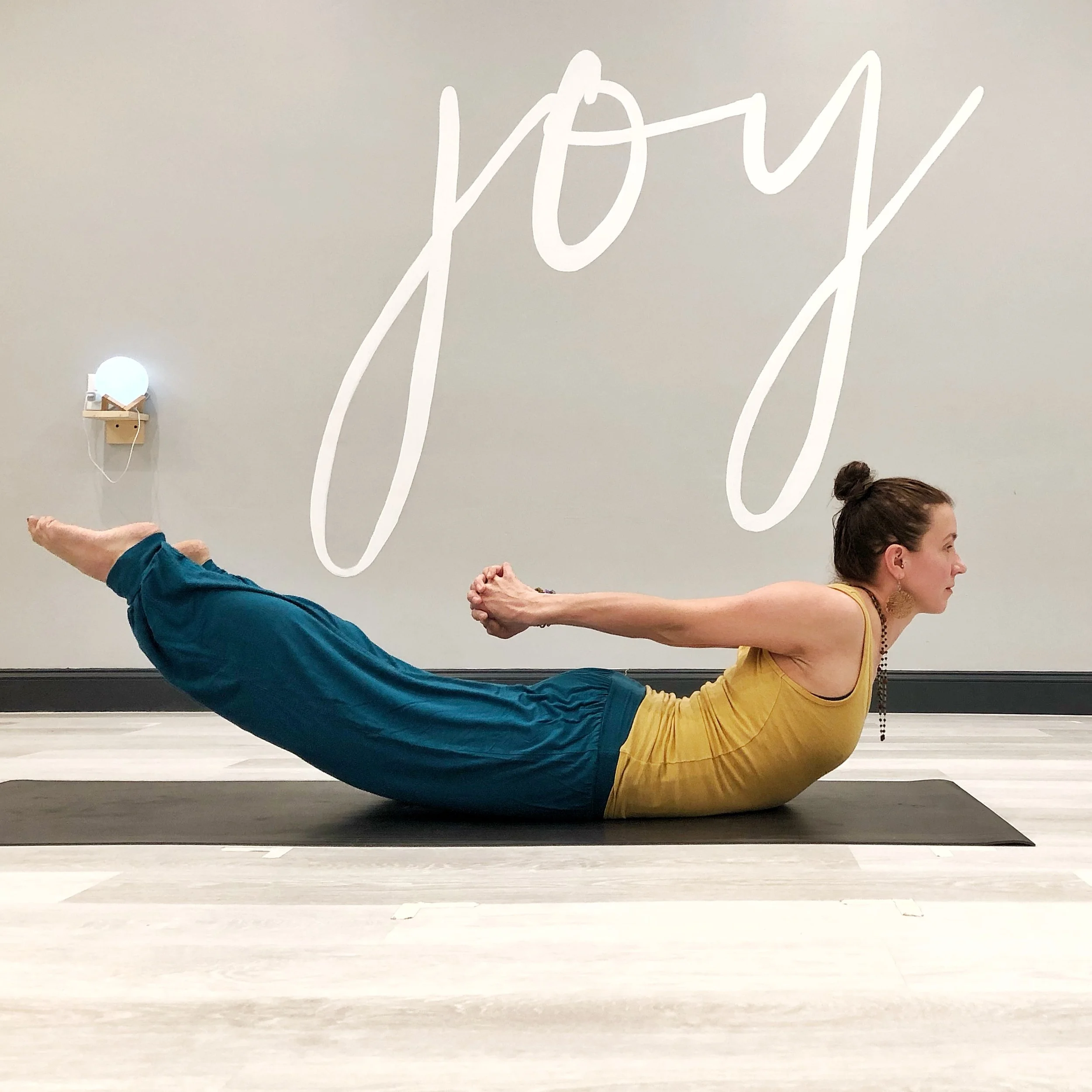 Samantha in Locust Pose. Learn more about Samantha on her page .