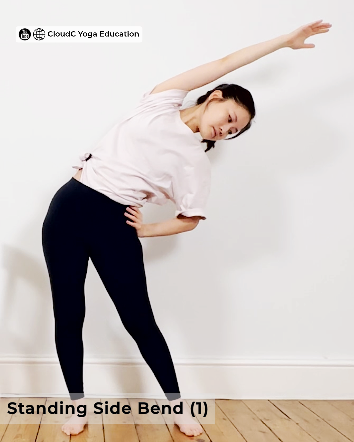 Woman in a standing side bend, right arm raised overhead, stretching the right side of the waist