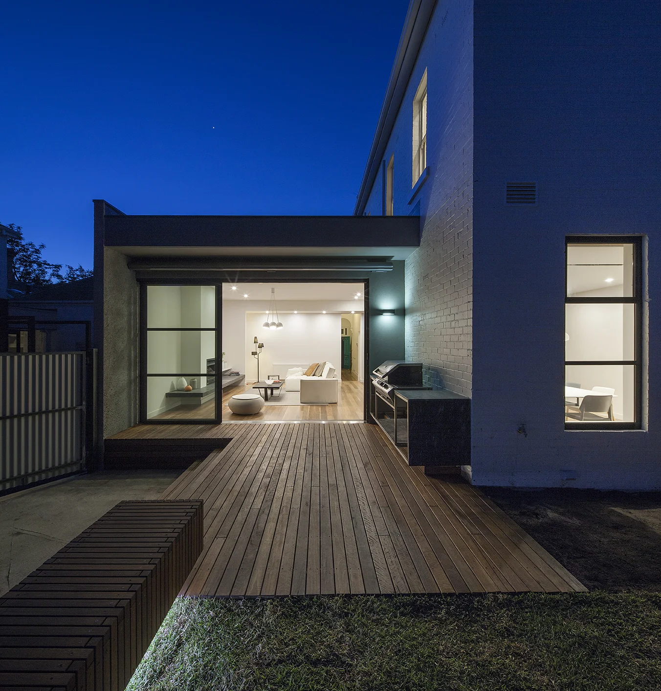 The existing 2-storey, semi-detached, south facing Victorian terrace presented an immediate challenge. Introverted and disjointed, the brief was to create a contemporary solution that maximised accommodation on the 360sq.m site, created a strong connection between rooms, and to the outdoors. The outcome is a 4 bedroom, 2 1/2 bathroom house , study/sitting room, large walk-in pantry and off-street parking. The palette reflects the nature of the original house – soft, warm colours and textures, offset by contemporary elements – steel doors, oak floors, burl timber veneer. Accents in blues and greens provide a sophisticated and at times playful thread; picked up in the tessellated tiles on the front verandah.