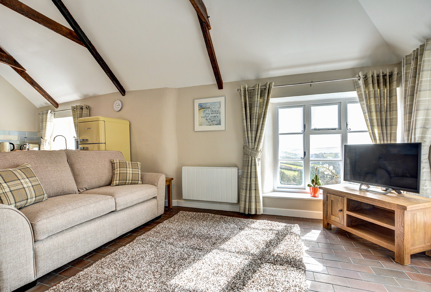 The lounge of Otterbridge luxury self catering converted barn holiday cottage at Penrose Burden in North Cornwall 03.jpg