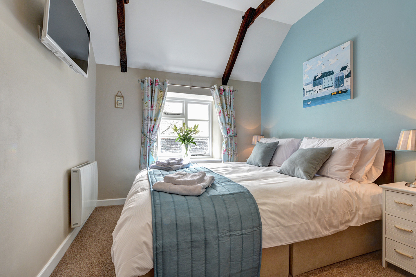 The master bedroom of Otterbridge luxury self catering converted barn holiday cottage at Penrose Burden in North Cornwall.jpg
