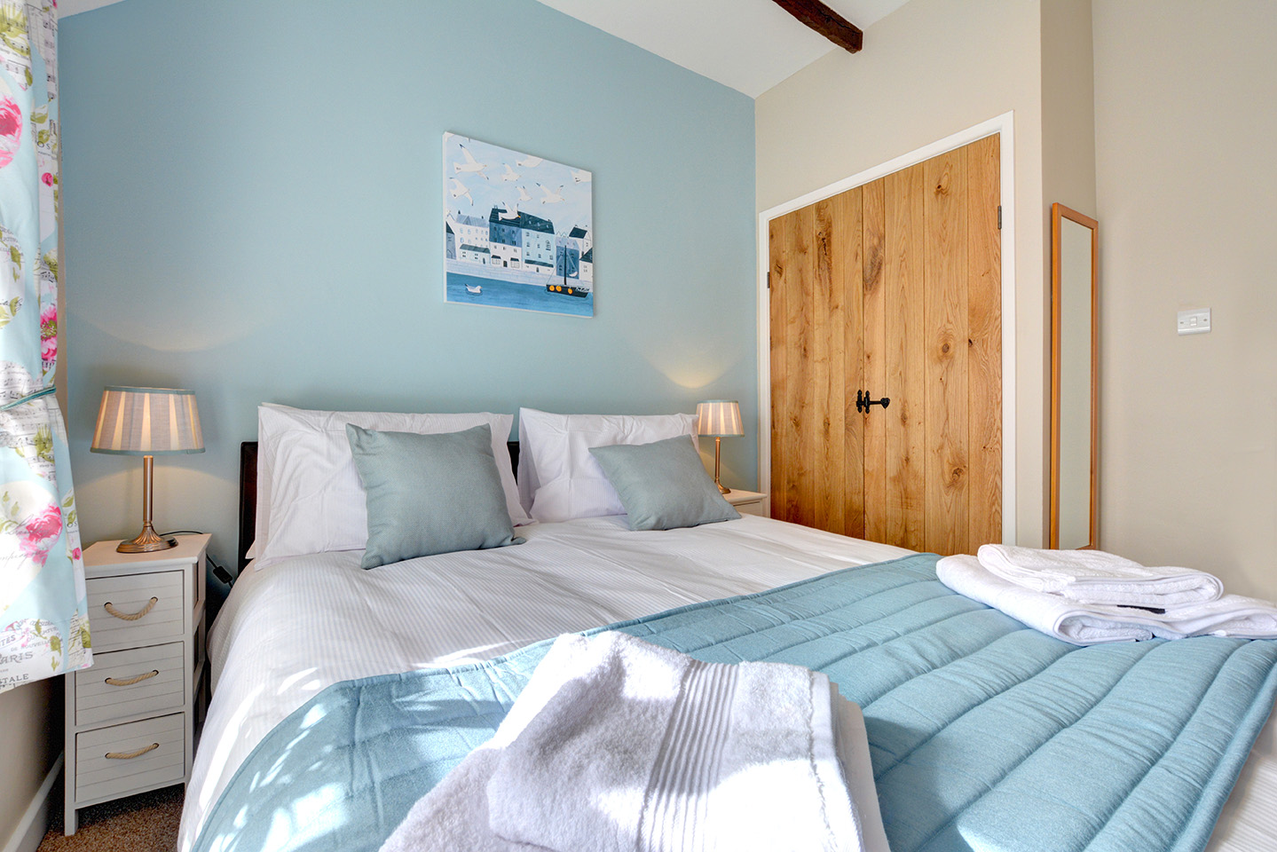 The master bedroom of Otterbridge luxury self catering converted barn holiday cottage at Penrose Burden in North Cornwall01.jpg