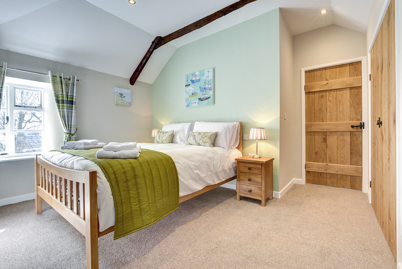 The second bedroom of Otterbridge luxury self catering converted barn holiday cottage at Penrose Burden in North Cornwall01.jpg