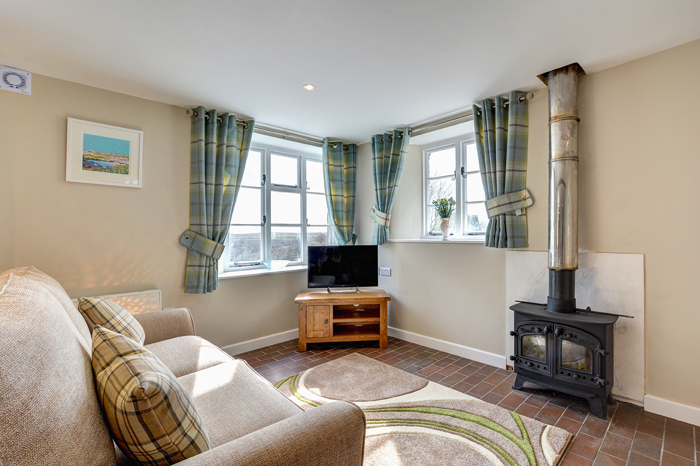 The lounge of Butterwell luxury self catering converted barn holiday cottage at Penrose Burden in North Cornwall 02.jpg