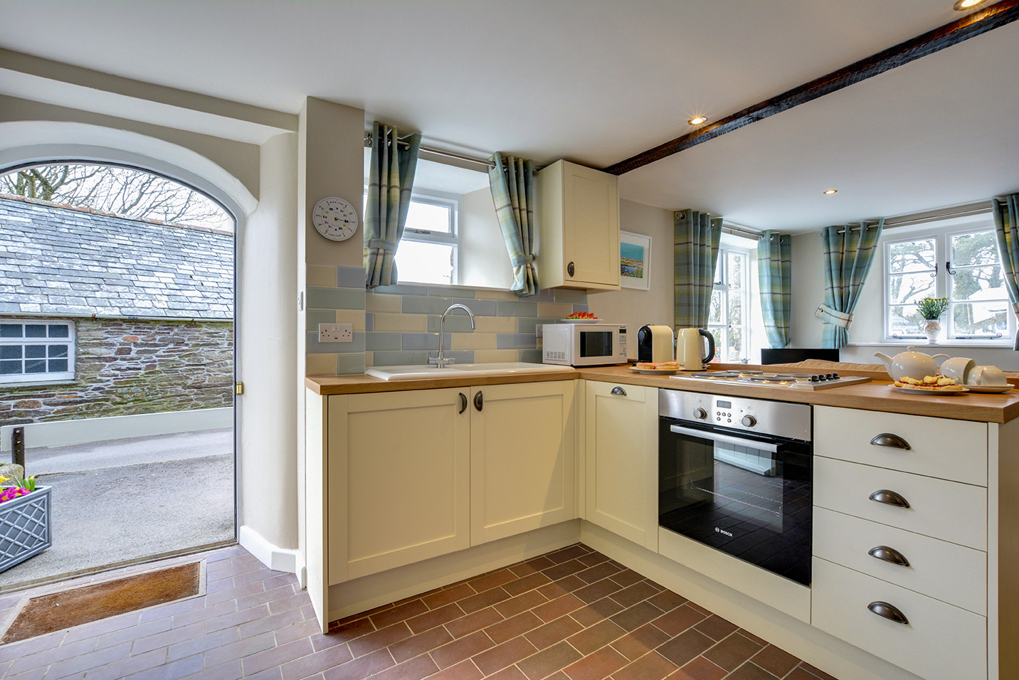 The kitchen of Butterwell luxury self catering converted barn holiday cottage at Penrose Burden in North Cornwall 01.jpg