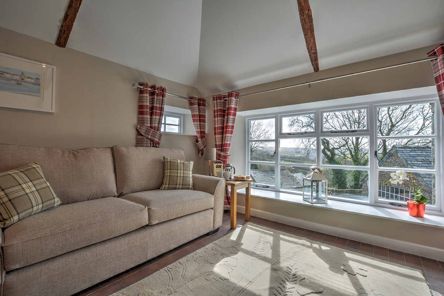 The lounge area of Goosehill luxury self catering converted barn holiday cottage at Penrose Burden in North Cornwall.jpg