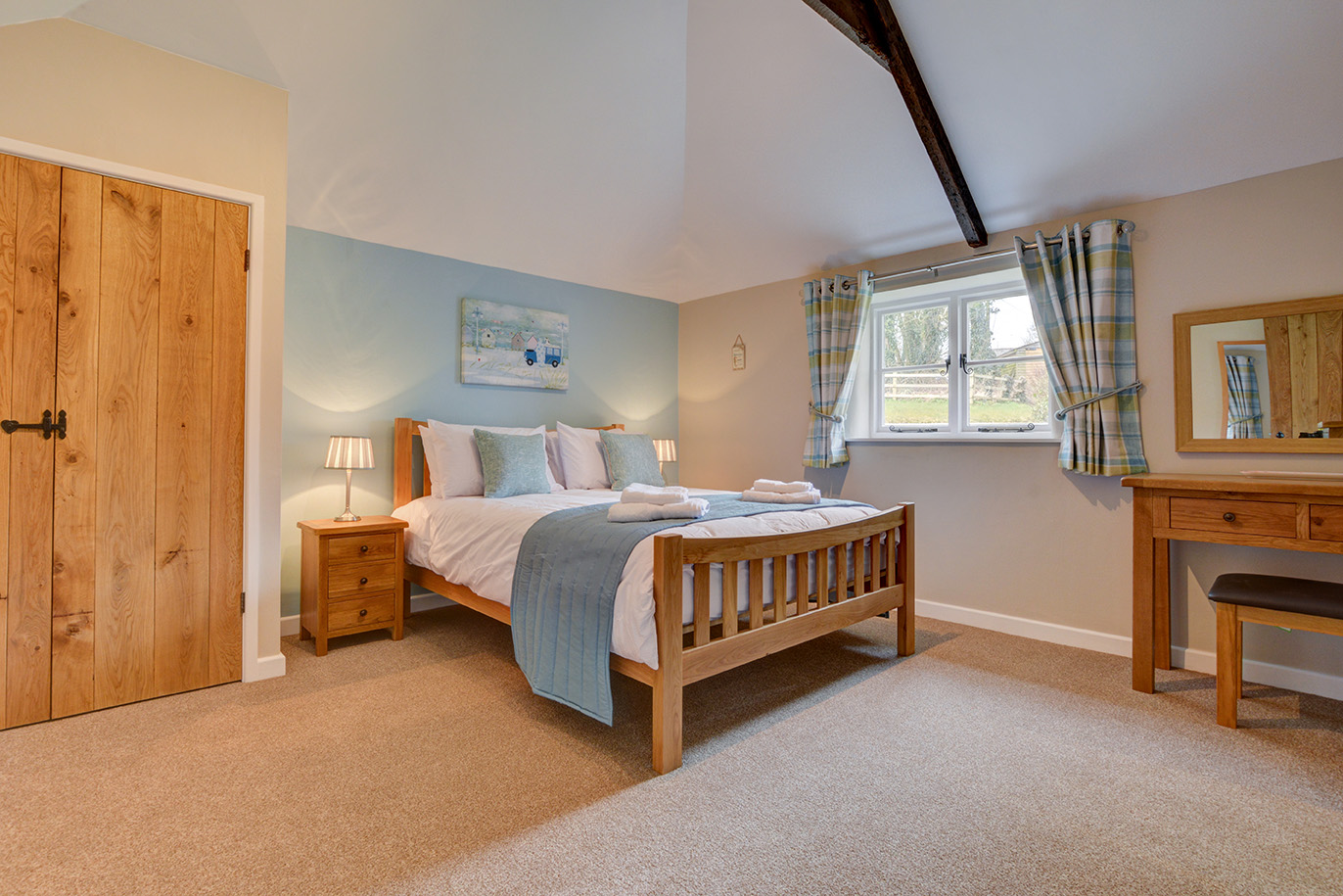 The second bedroom of Goosehill luxury self catering converted barn holiday cottage at Penrose Burden in North Cornwall 02.jpg