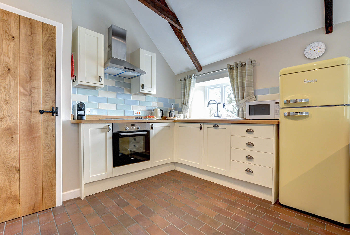 The kitchen of Otterbridge luxury self catering converted barn holiday cottage at Penrose Burden in North Cornwall.jpg