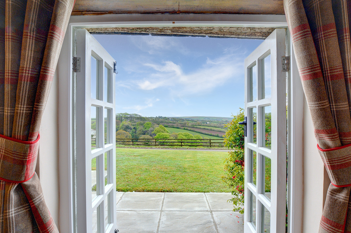 The view from the patio doors of The Linney self catering cottage converted barn at Penrose Burden holiday cottages in Cornwall.jpg